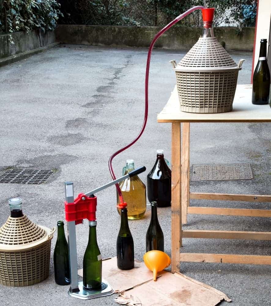 homemade wine bottling in the backyard