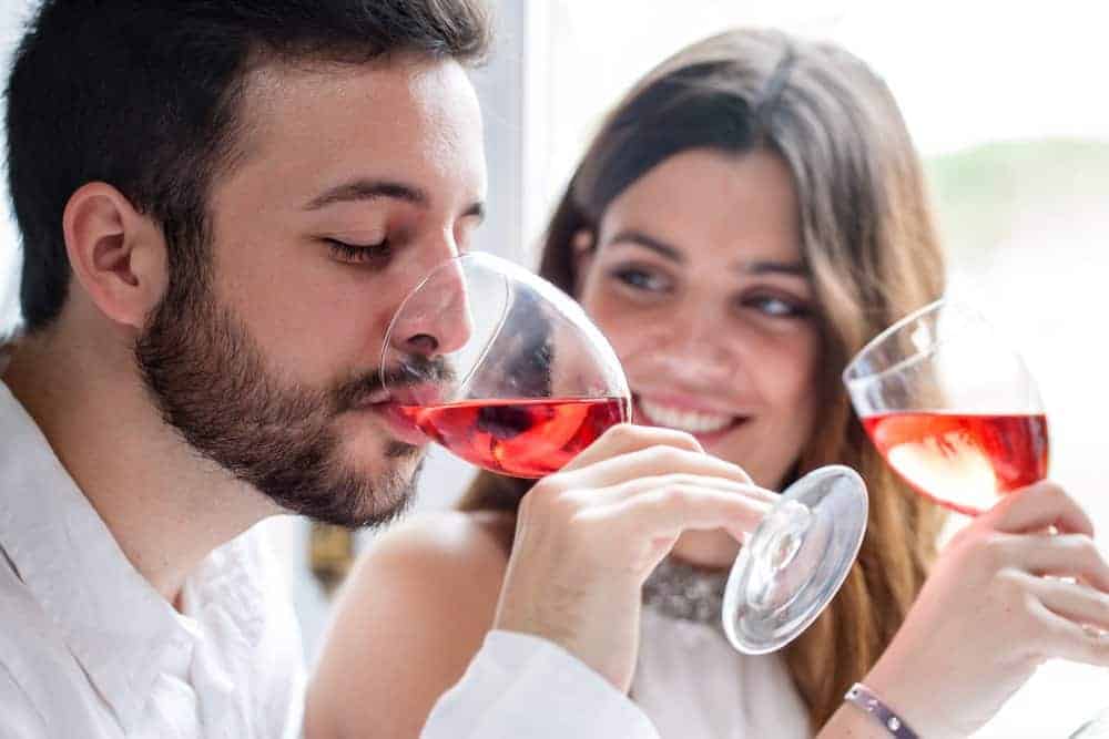 Couple enjoying wine tasting.