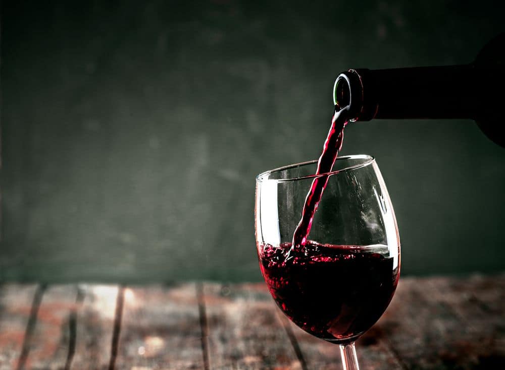 Red wine. Glass of wine. Pouring red wine.