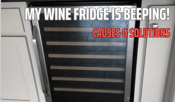 Wine fridge between cabinets