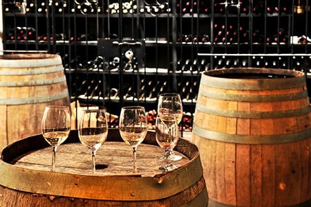 Wine glasses on barrels