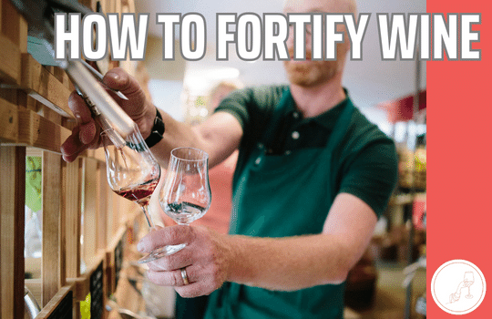 man pouring fortified wine into glass