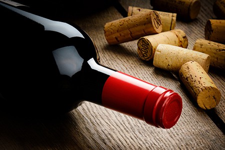red wine bottle and corks