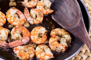 shrimp scampi cooking in a pan