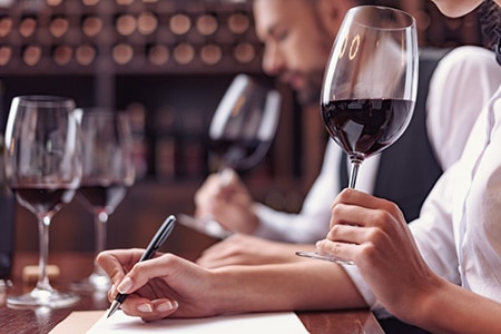 Sommeliers taking wine tasting notes