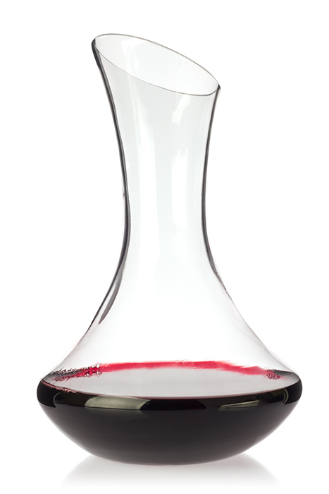 red wine being decanted in decanter