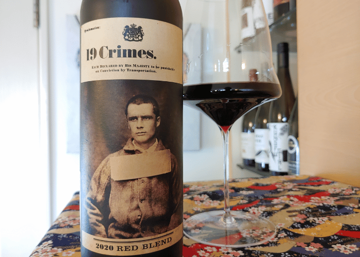 19 Crimes red wine bottle and glass