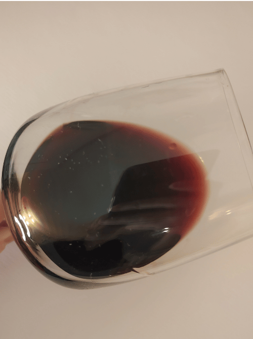 19 Crimes red wine color in glass