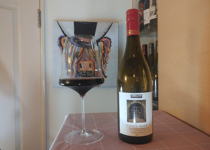 Costco Kirkland Pinot Noir bottle and in glass