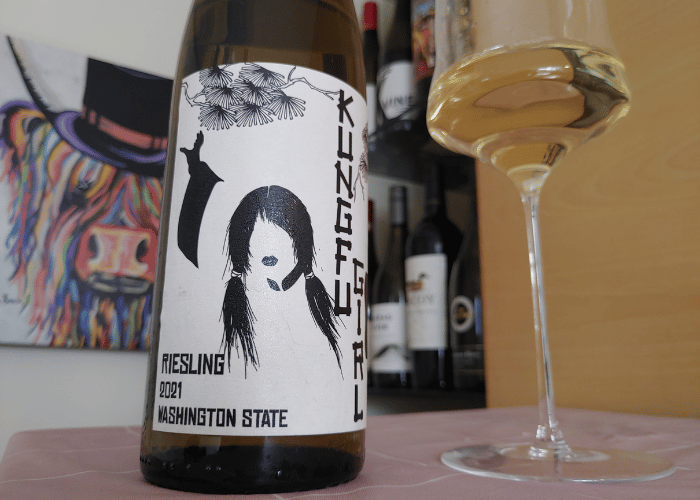 Kung fu girl riesling in wine glass and bottle